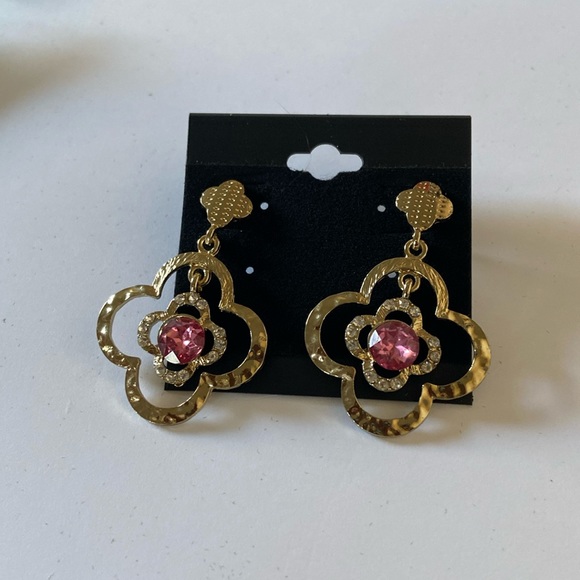 Jewelry - Pretty gold tone earrings with purple color stone